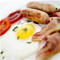 Breakfast foods including eggs.